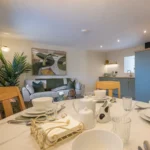 Open-plan dining, living and kitchen area at Tower Lodge